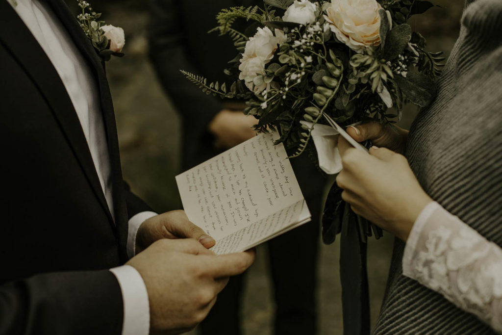 handwritten vows on car and flowers