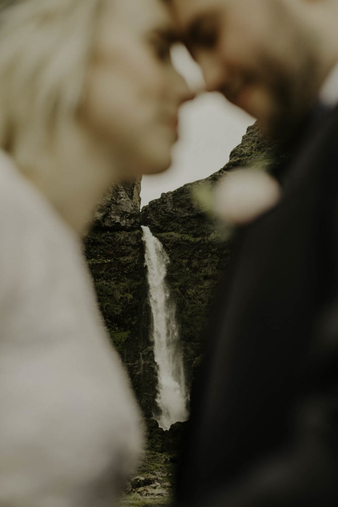 bride and groom getting married at waterfall in southern Iceland