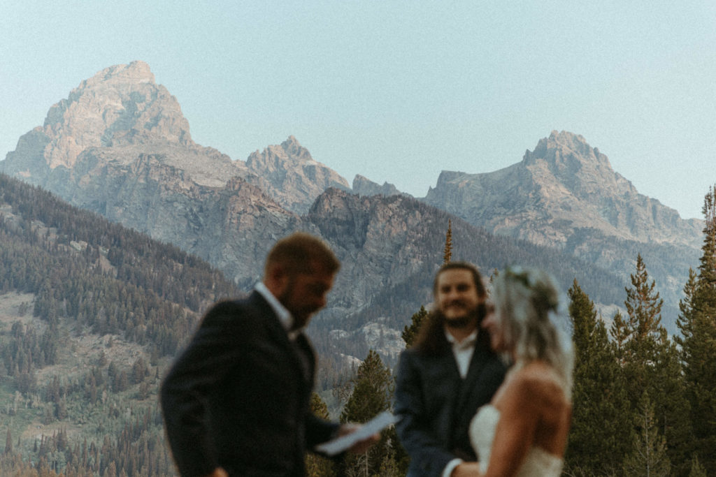 marriage ceremony with the mountains in the background.