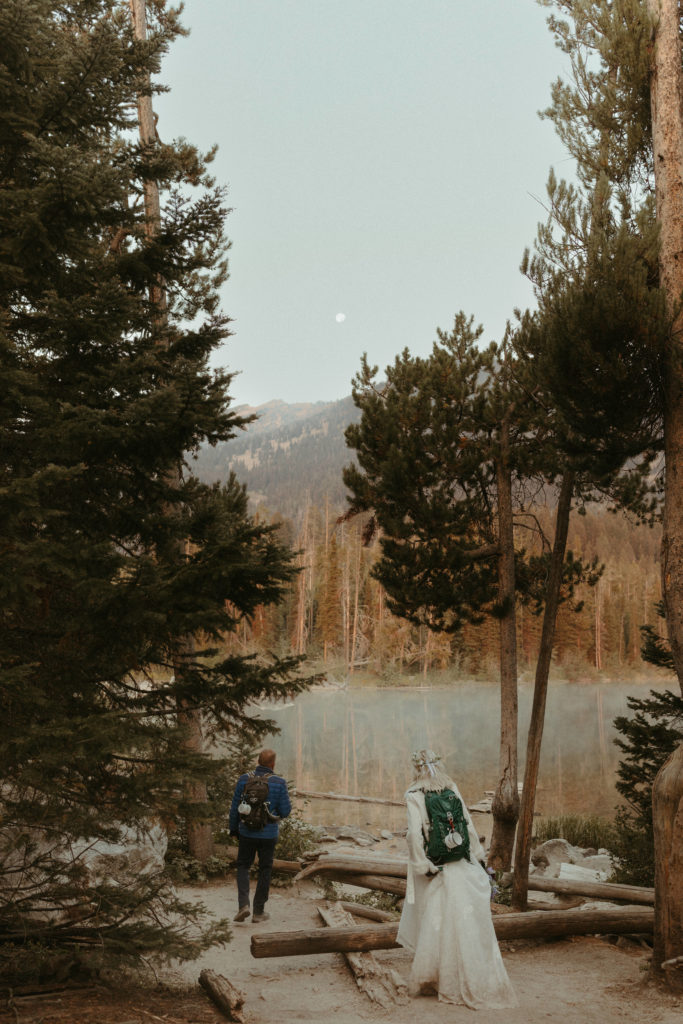 Grand teton elopement package that includes bride and groom hiking. 